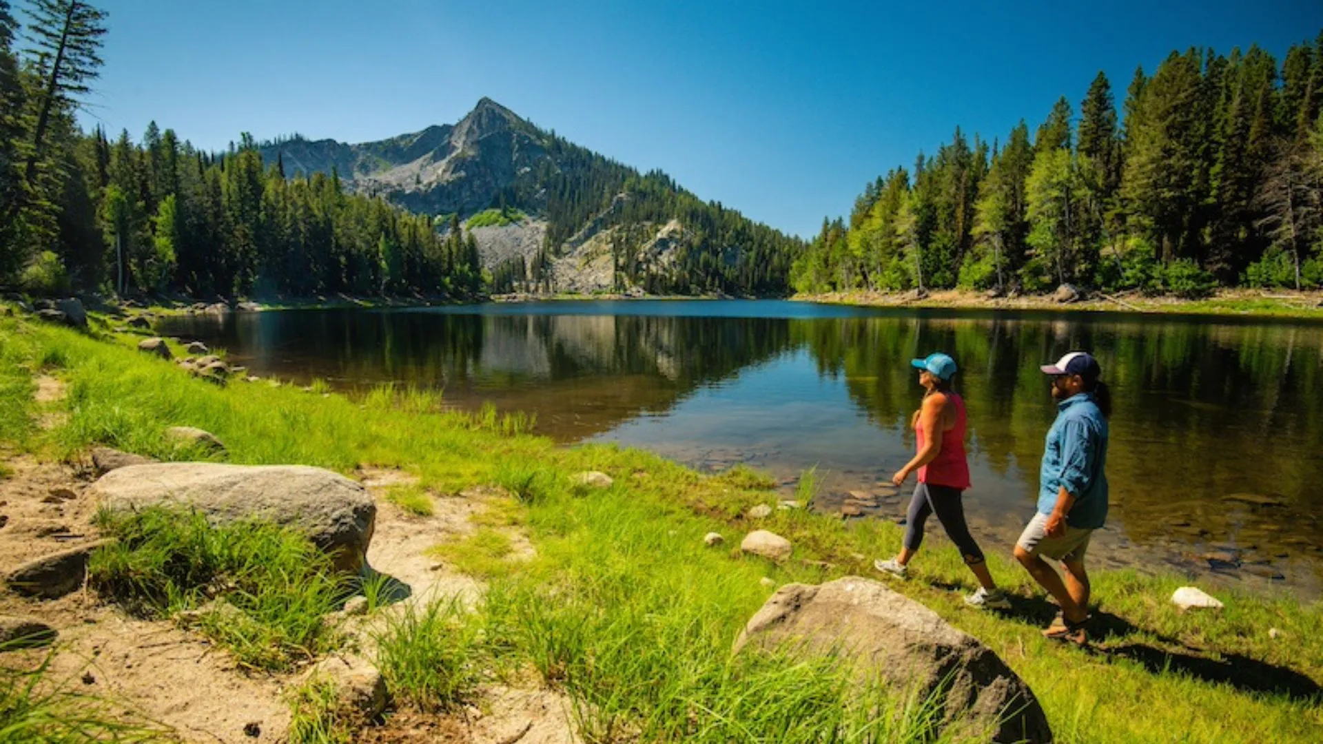 View of Idaho landscape showcasing water, forests, and mountains representing land investment growth and emerging market trends